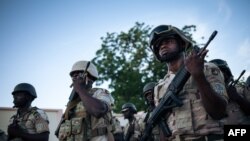 FILE - Soldiers perform their duties at the Multinational Joint Task Force base in Mora, Cameroon, Sept. 28, 2018. 