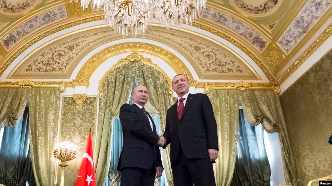 Russian President Vladimir Putin, left, shakes hands with Turkey's President Recep Tayyip Erdogan during their meeting in the Kremlin in Moscow, March 10, 2017.