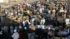  People gather to buy charcoal at a busy market in Lusaka, Zambia, July, 5, 2021. In June 2023, Zambia has reached a deal with China and several other government creditors to restructure $6.3 billion in loans. (AP Photo/Tsvangirayi Mukwazhi)