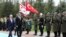 Turkish Prime Minister Binali Yildirim, left, and Tufan Erhurman, the prime minister of the self-declared Turkish Cypriot state in the north of the divided island, review a military honour guard during a ceremony at the Cankaya Palace in Ankara, Turkey, Wednesday, March 7, 2018.