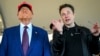 FILE - President-elect Donald Trump, left, listens to Elon Musk as he arrives to watch SpaceX's mega rocket Starship lift off for a test flight from Starbase in Boca Chica, Texas, Nov. 19, 2024. (Brandon Bell/Pool)