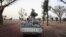 Militiaman from the Ansar Dine Islamic group ride on an armed vehicle between Gao and Kidal, northeastern Mali, June 12, 2012.
