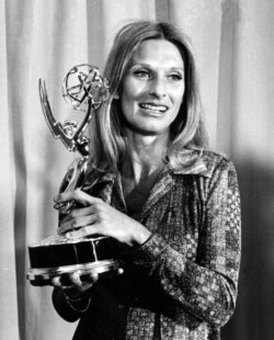FILE - Cloris Leachman poses with her Emmy award for outstanding single performance by an actress in "A Brand New Life" at the Emmy Awards presentation in Los Angeles, May 21, 1975.