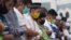 Muslims wearing face masks offer the Eid al Fitr prayer together amid the coronavirus outbreak at Al Mashun Grand Mosque in Medan, North Sumatra, Indonesia, May 24, 2020.