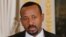 Ethiopian Prime Minister Abiy Ahmed meets members of opposition parties, Nov. 27, 2018, and promises fair elections.