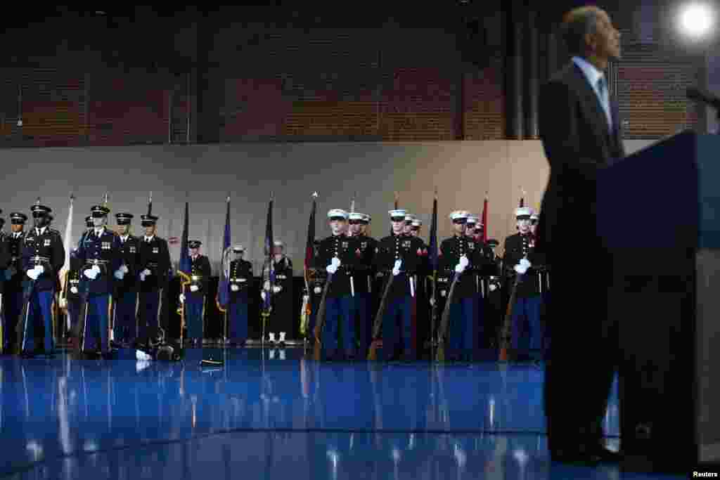 A member of the army collapses as U.S. President Barack Obama speaks during a military full honor review farewell ceremony given in his honor at Joint Base Myer-Henderson in Washington, Jan. 4, 2017.