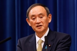 FILE - Japan's Prime Minister Yoshihide Suga speaks during a press conference at the prime minister's official residence in Tokyo, Jan. 13, 2021.