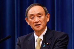 FILE - Japan's Prime Minister Yoshihide Suga speaks during a press conference at the prime minister's official residence in Tokyo, Jan. 13, 2021.