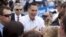 Republican presidential candidate and former Massachusetts Gov. Mitt Romney shakes hands during a campaign event in Hobbs, New Mexico, Aug. 23, 2012.