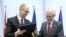 Ukrainian Prime Minister Arseniy Yatsenyuk (left) and European Council President Herman Van Rompuy exchange documents at the signing ceremony in Brussels on March 21.