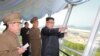 FILE - North Korean leader Kim Jong Un inspects the construction site of the Wonsan-Kalma tourist area as Kim Su Gil, third from left, new director of the General Political Bureau of the Korean People's Army, looks on, in this undated photo.