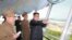 FILE - North Korean leader Kim Jong Un inspects the construction site of the Wonsan-Kalma tourist area as Kim Su Gil, third from left, new director of the General Political Bureau of the Korean People's Army, looks on, in this undated photo.