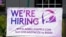 FILE - A hiring sign is displayed outside a restaurant during the COVID-19 pandemic in Glenview, Ill., May 8, 2021. 
