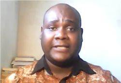 Alexander Rusero, a former journalism and international relations lecturer at Harare Polytechnic college says he is not surprised Zimbabwe's government and its supporters have condemned Hopewell Chin’ono’s song. (Skype screenshot; Columbus Mavhunga)