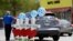 Four wooden crosses stand as a memorial for the four shooting fatalities outside a Waffle House restaurant, April 25, 2018, in Nashville, Tenn. The restaurant re-opened Wednesday after four people were killed by a gunman Sunday.