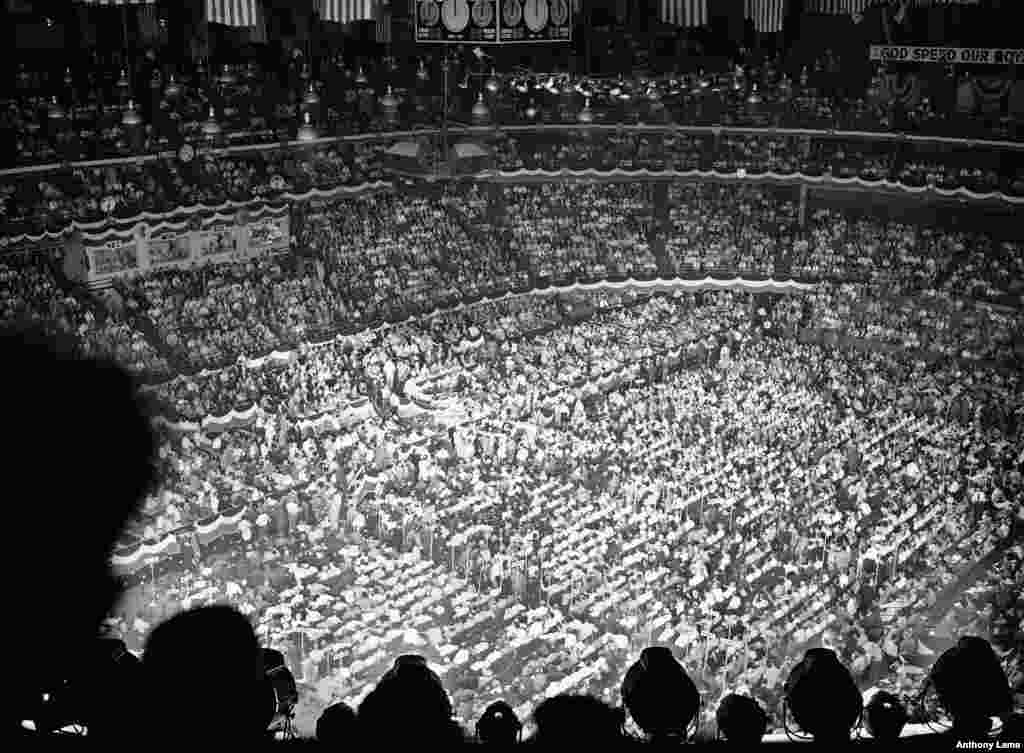 FILE - Delegates and spectators at the Republican National Convention fill in the Chicago stadium to hear Governor Earl Warren of California deliver the keynote address, June 26, 1944. Thomas Dewey and John Bricker were nominated as president and vice president, respectively.