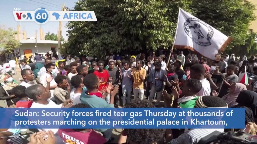 VOA60 Africa- Security forces fired tear gas Thursday at thousands of protesters marching on the presidential palace in Khartoum