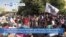 VOA60 Africa- Security forces fired tear gas Thursday at thousands of protesters marching on the presidential palace in Khartoum