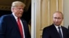 (FILES) US President Donald Trump (L) and Russian President Vladimir Putin arrive for a meeting in Helsinki, on July 16, 2018.