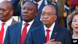 FILE - South African President Jacob Zuma, right, alongside deputy president Cyril Ramaphosa, left, outside parliament at the State of the Nation address in Cape Town, South Africa, Feb. 9, 2017.