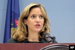 FILE - In this March 5, 2020 photo, Michigan Secretary of State Jocelyn Benson speaks at a news conference in Lansing, Mich.