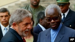 FILE - Mathieu Kerekou, right, who was then the president of Benin, is pictured after a meeting with then-Brazilian President Luiz Inacio Lula da Silva in Cotonou, Benin, Feb. 10, 2006. 