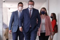 Senator Ted Cruz, R-TX, walks with staff members before speaking to news reporters following a series of meetings on efforts to pass new coronavirus aid legislation on Capitol Hill in Washington, July 21, 2020.