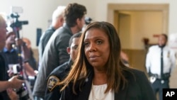 FILE - New York attorney general Letitia James steps out of the courtroom doing a short break in the civil business fraud trial against former President Donald Trump at New York Supreme Court, Monday, Oct. 2, 2023, in New York.