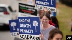 Vivian Lovingood protests prior to the execution of South Carolina inmate Brad Sigmon, March 7, 2025, in Columbia, S.C. Sigmon became the first U.S. inmate in 15 years to be executed by a firing squad.