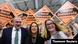 Liberal Democrats candidate Jane Dodds, center, reacts after winning the by-election for the district of Brecon and Radnorshire at the Royal Welsh Showground, near Builth Wells in Wales, Britain Aug. 2, 2019. 