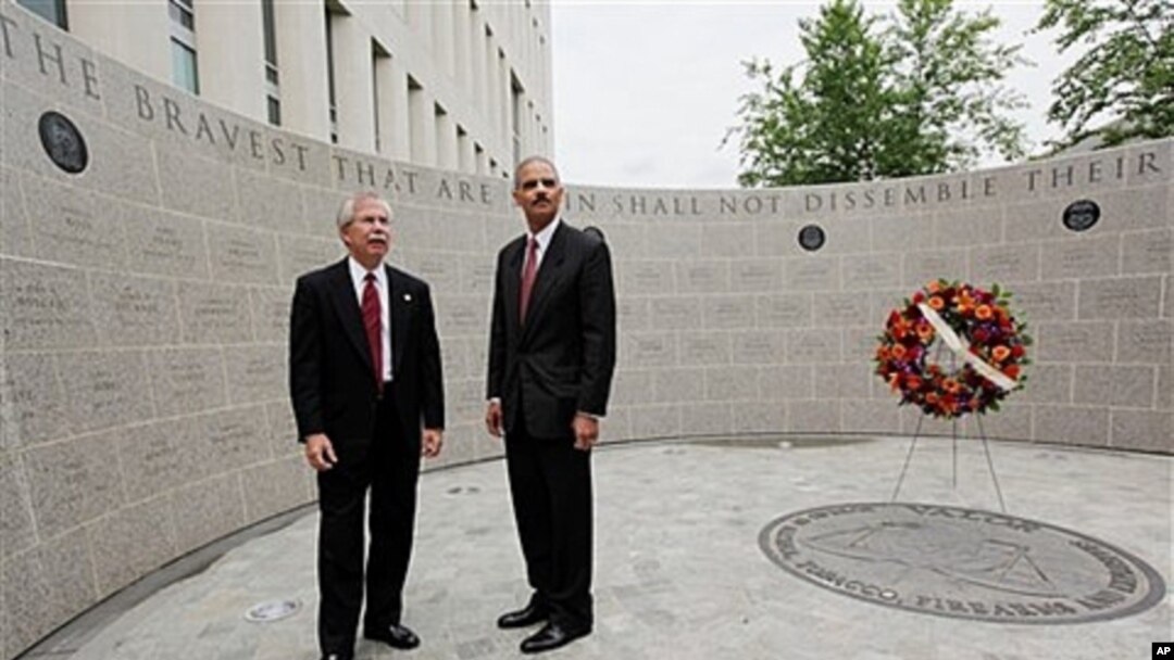 Attorney General Eric Holder, right, and former ATF Director Kenneth Melson at the ATF's 13th Annual Memorial Observance for agency officials killed in line of duty, May 2009 (file photo).