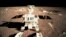 FILE - This image taken from video, shows China's first moon rover touching the lunar surface on Dec. 15, 2013.