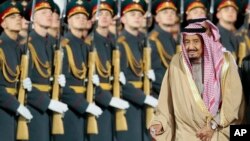 Saudi King Salman reviews an honor guard upon arrival in Moscow's Government Vnukovo airport, Russia, Oct. 4, 2017. The king's visit was the first trip to Russia by a sitting Saudi monarch. 