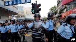 Hong Kong police push back protesters in Hong Kong Saturday, July 13, 2019. Several thousand people marched in Hong Kong on Saturday against traders from mainland China in what is fast becoming a summer of unrest in the semi-autonomous Chinese territory.