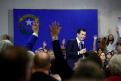 FILE - Democratic presidential candidate, former South Bend, Ind., Mayor Pete Buttigieg speaks as attendees raise their hands to ask questions during a campaign event at Durango Hills Community Center in Las Vegas, Feb. 18, 2020.