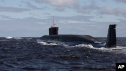 FILE - A Russian nuclear submarine, Yuri Dolgoruky, is seen during sea trials near Arkhangelsk, Russia, July 2, 2009.