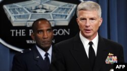 FILE - Rear Admiral Craig Faller, right, U.S. Navy Recruiting Command and Brig. General Alfred Stewart, U.S. Air Force Recruiting Service brief the media, Oct. 13, 2009, at the Pentagon in Washington.