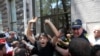 Protesters storm the office of LGBT+ campaigners at a rally against the planned March for Dignity during Pride Week in Tbilisi, Georgia, July 5, 2021. 