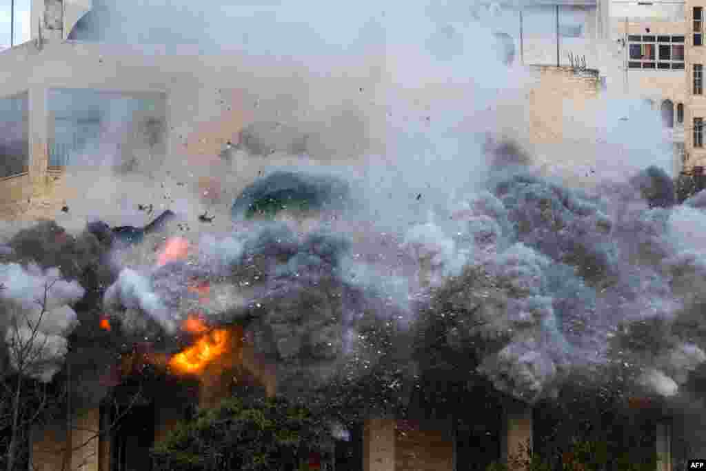 The house of a Palestinian man accused of an attack against Israelis in October 2024 in Jaffa, is blown up by Israeli security forces in Hebron, in the occupied west Bank.