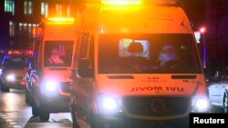 An ambulance carrying a Spanish nurse who has contracted Ebola arrives at the Carlos III Hospital in Madrid, Oct. 7, 2014, in this still image taken from video.