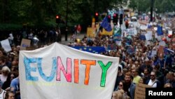 People hold banners during a "March for Europe" demonstration against Britain's decision to leave the European Union, in central London, Britain, July 2, 2016. Britain voted to leave the European Union in the EU Brexit referendum. 