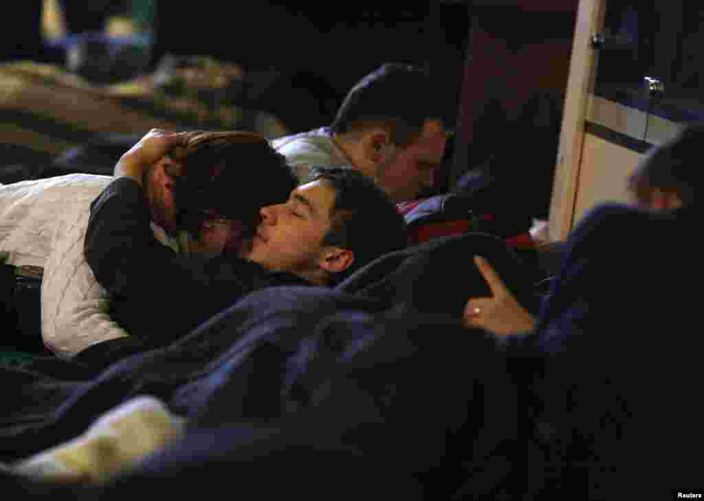 Protesters rest inside Kyiv&#39;s City Hall building, Dec. 6, 2013.