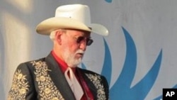 Doyle Lawson tunes up at the 2010 Grey Fox Bluegrass Festival