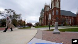 A man walks through downtown Painesville, Ohio, in Lake County, Nov. 17, 2021. 
