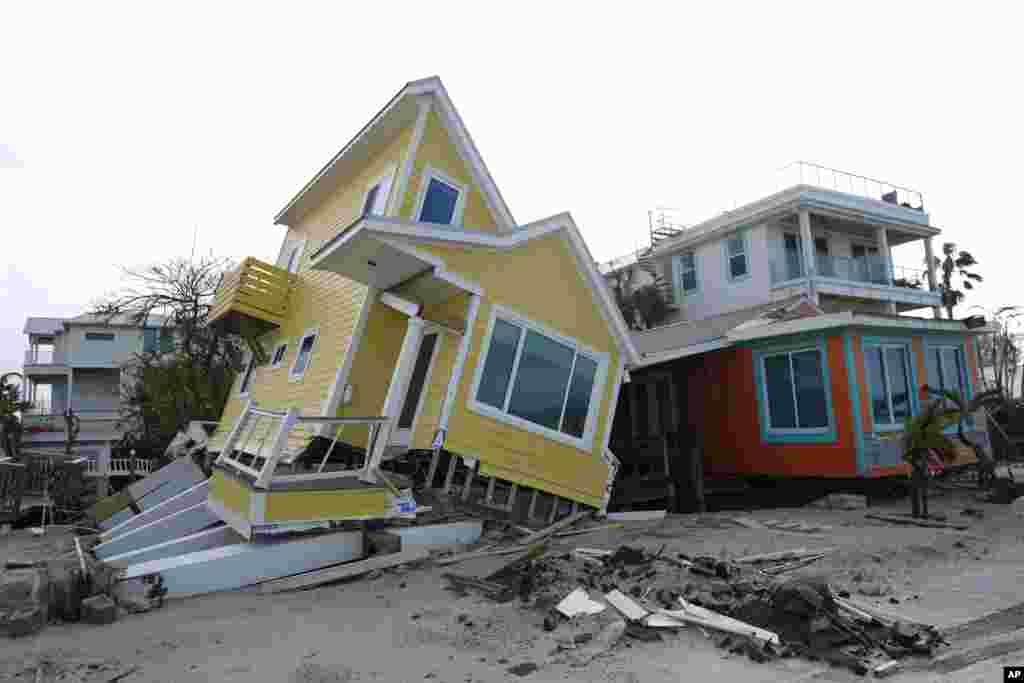 A house lies toppled off its stilts after the passage of Hurricane Milton, in Bradenton Beach on Anna Maria Island, Florida.