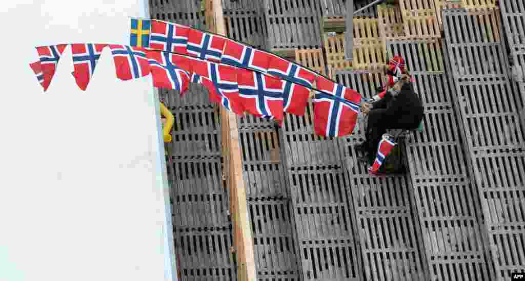 Norwegian supporters follow the Nordic Combined ski jumping competition in the ski stadium of the 2015 FIS Nordic World Ski Championships in Falun, Sweden.