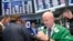 FILE - Traders work on the floor of the New York Stock Exchange (NYSE) in New York City.