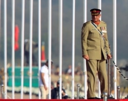 FILE - Pakistan's army chief of staff, Gen. Qamar Javed Bajwa, arrives to attend the Pakistan Day military parade in Islamabad, Pakistan, March 23, 2017.