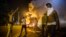Demonstrators stand in the middle of West Florissant as they react to tear gas fired by police during ongoing protests in reaction to the shooting of teenager Michael Brown, in Ferguson, Missouri, Aug. 18, 2014. REUTERS/Lucas Jackson (UNITED STATES - Ta