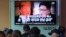 People watch a TV screen showing images of U.S. President Donald Trump, left, and North Korean leader Kim Jong Un during a news program at the Seoul Railway Station in Seoul, South Korea, May 25, 2018. 